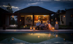 Pool by night at Acacia Farm Lodge