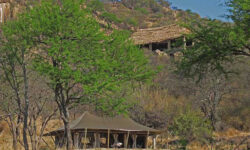 Tent exterior with lounge at Serengeti Pioneer Camp